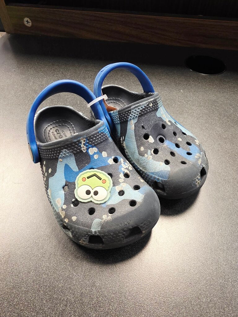 *has wear Blue Crocs