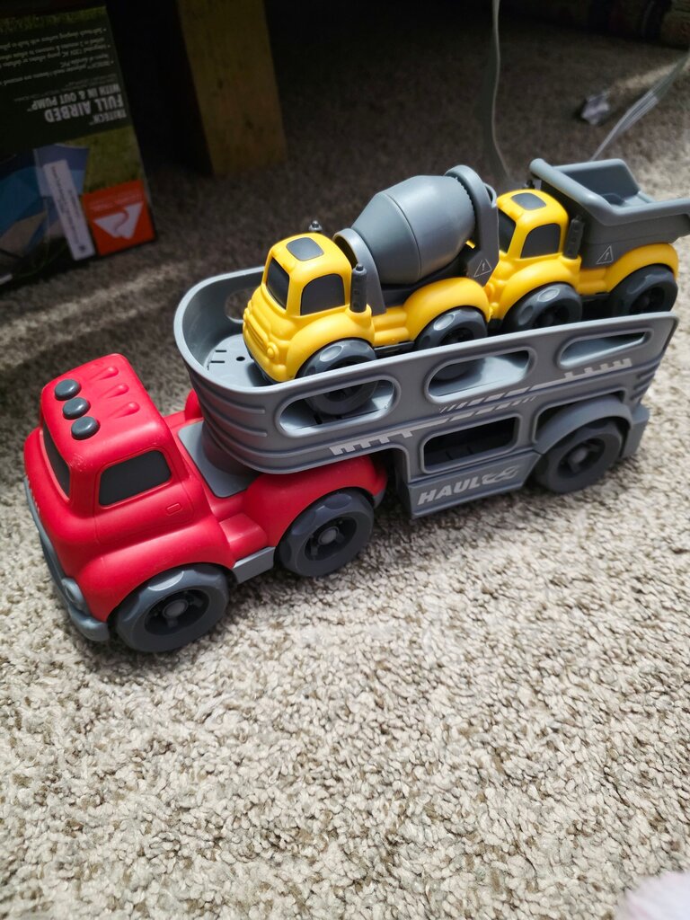 Red Toy Truck with Yellow Construction Vehicles